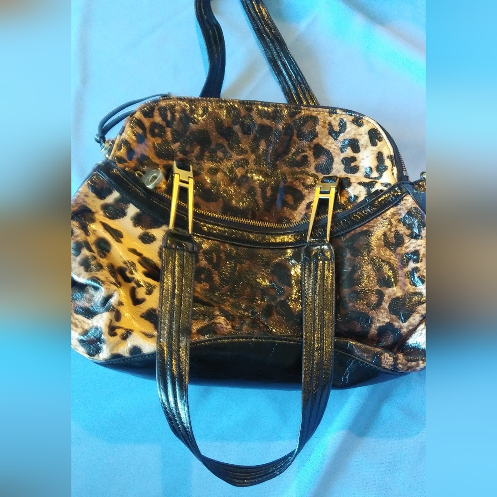 Greta Leopard glossy design many zippers and openings 15 x 11 inches